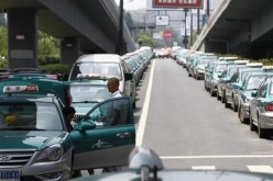 Striking taxi drivers under a bridge in the suburbs of Hangzhou.