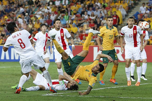Tim Cahill (No. 4) scores a goal against China in the AFC Cup Group Stages. 