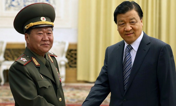 Liu Yunshan (right), a senior Chinese Communist party official, poses for the cameras.