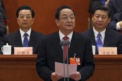 Yu Zhengsheng (C) speaks before the Central Committee of the Communist Party.