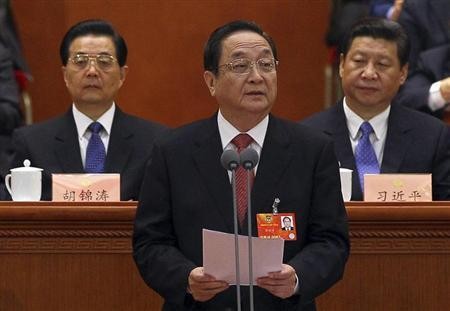 Yu Zhengsheng (C) speaks before the Central Committee of the Communist Party.