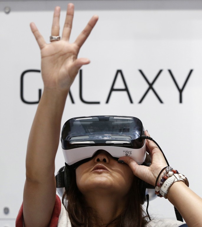A visitor tries out Samsung's Galaxy Gear VR at its booth in Tokyo Game Show 2014 in Makuhari, east of Tokyo September 18, 2014. About 421 companies and organizations are participating in the Tokyo Ga