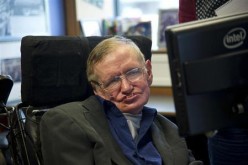 English physicist Stephen Hawking sits at his desk in the Applied Mathematics Department of Cambridge University, Aug. 30, 2012.