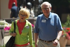 Berkshire Hathaway chairman and CEO Warren Buffett (R) and his wife Astrid