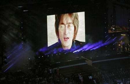 John Lennon is Yoko Ono's husband and was Ringo Starr, Paul McCartney and George Harrison's The Beatles co-member.