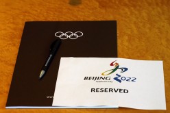 A sign is placed on a table for members of the Beijing 2022 delegation at the start of the Executive Board meeting at the International Olympic Committee (IOC) headquarters in Lausanne, July 7, 2014.