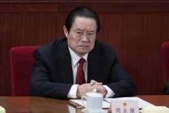 China's former Politburo Standing Committee Member Zhou Yongkang was arrested for corruption in Dec. 2014, so even if the proposal passes, it will not apply to him. 