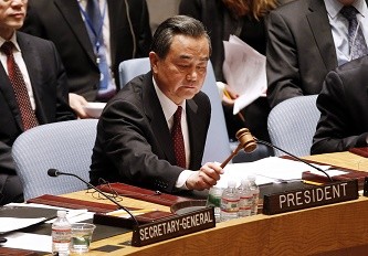 Chinese Foreign Minister Wang Yi presides over a U.N. Security Council meeting. 