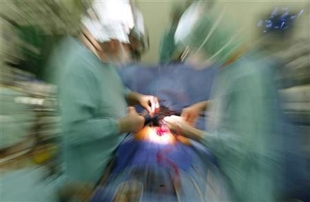 Two surgeons performing a heart operation.
