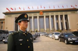 A police officer guards China's parliamentary building.