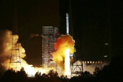 An experimental spacecraft lifts off from the launch pad at the Xichang Satellite Launch Center in Sichuan Province.