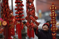 A woman looks at Chinese Lunar New Year decorations.
