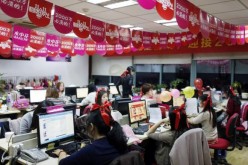 Employees processing orders on Tmall.