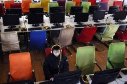 A man using a computer at an Internet cafe in China's Shanxi Province.