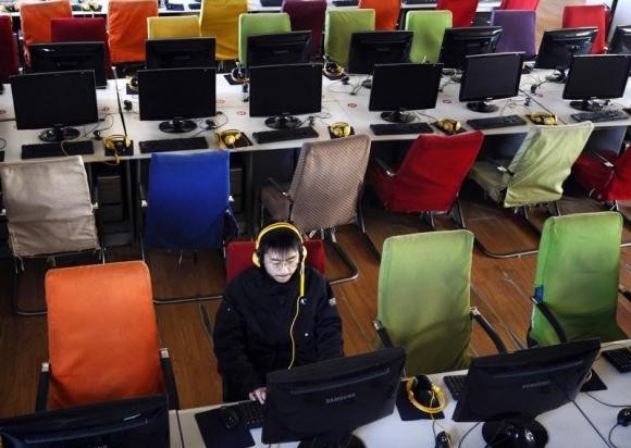 A man using a computer at an Internet cafe in China's Shanxi Province.