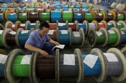 Newly made optical cables undergo final inspection at a factory in Wuhan, Hubei Province.
