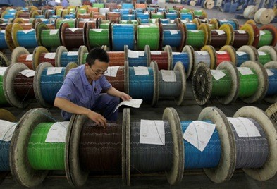 Newly made optical cables undergo final inspection at a factory in Wuhan, Hubei Province.