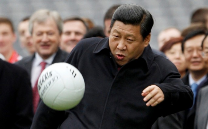 President Xi Jinping kicks a football during a U.K. visit.