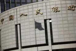 The People's Bank of China makes borrowing money cheaper by further cutting down interest rates.