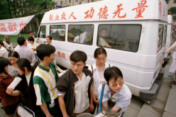 Volunteer blood donors at a mobile laboratory in Chengdu, China.