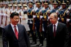 Chinese President Xi Jinping and Russian President Vladimir Putin in a welcome ceremony for a Confidence Building Summit in Shanghai last year.