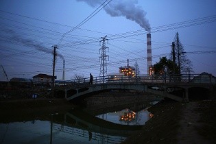 Smoke rises from the chimneys of a thermal power plant in Shanghai.