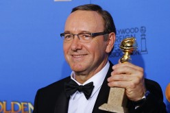 Kevin Spacey poses backstage with his award for Best Performance by an Actor in a Television Series for 