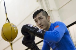 Zou Shiming of China works out in front of the media at the Venetian Macao hotel in Macau, March 5, 2015.