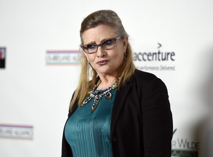 Honoree Carrie Fisher poses at the Oscar Wilde Awards at director J.J. Abrams' Bad Robot production company in Santa Monica, California February 19, 2015.