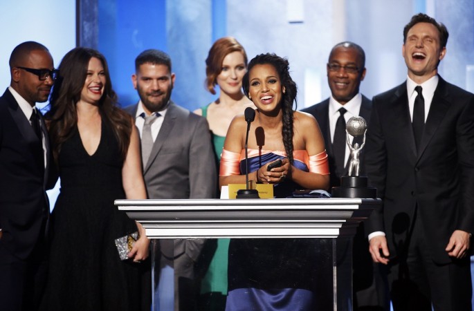 Actress Kerry Washington (C) and the cast and crew of "Scandal" accept the award for outstanding drama series during the 45th NAACP Image Awards in Pasadena, California February 22, 2014. REUTERS/Danny Moloshok