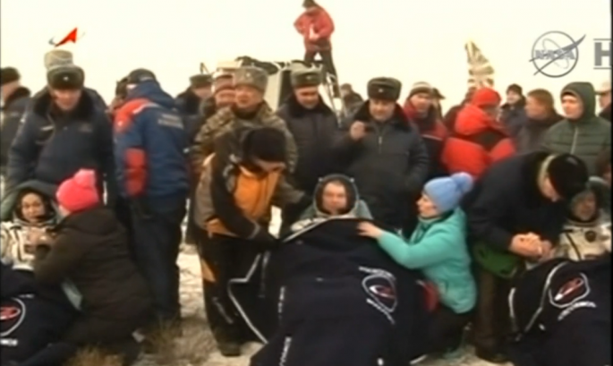 NASA astronaut and two Russian cosmonauts landed safely in a snow-covered Kazakh steppe.