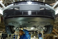 Chinese workers assemble a Volkswagen Passat at Shanghai Volkswagen plant.