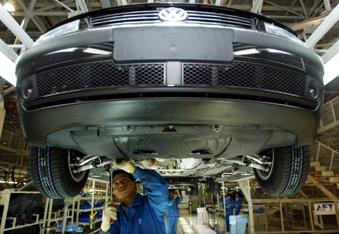 Chinese workers assemble a Volkswagen Passat at Shanghai Volkswagen plant.