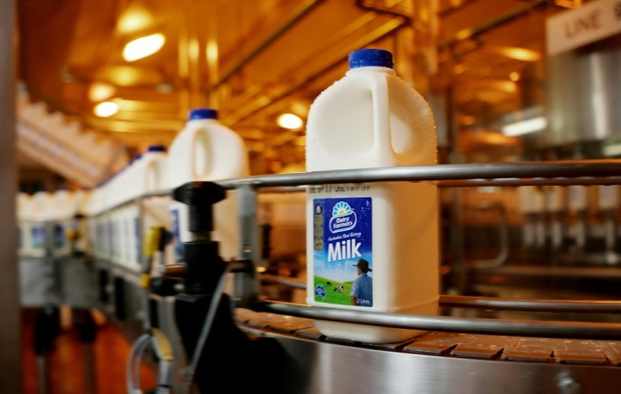 Bottles of milk are seen on the production line at a Dairy Farmers processing facility.