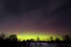 The glow of the Aurora Borealis, or Northern Lights, is seen in the horizon in the Kawartha Lakes region, southern Ontario February 23, 2015. The colorful cosmic display of the northern lights is rarely seen in Ontario. 