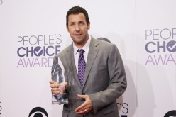 Actor Adam Sandler poses backstage with his award for Favorite Comedic Movie Actor during the 2015 People's Choice Awards in Los Angeles, California January 7, 2015.