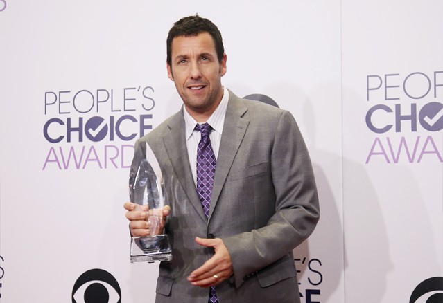 Actor Adam Sandler poses backstage with his award for Favorite Comedic Movie Actor during the 2015 People's Choice Awards in Los Angeles, California January 7, 2015.