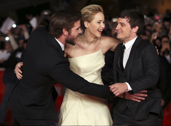 Cast members Jennifer Lawrence (C), Liam Hemsworth (L) and Josh Hutcherson (R) arrive for the screening of the movie "The Hunger Games: Catching Fire" at the Rome Film Festival November 14, 2013.