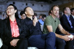 HTC Chairwoman Cher Wang sits with other company officials at a product launch.