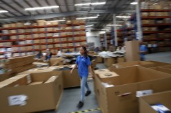 An employee of Mopar's Asia Pacific Regional Parts Distribution Center, operating at the Shanghai Free Trade Zone, works during a government organized media tour, Sept. 24, 2014.