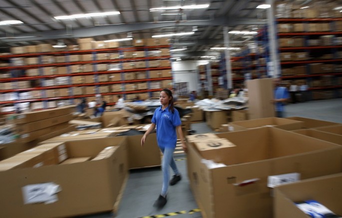 An employee of Mopar's Asia Pacific Regional Parts Distribution Center, operating at the Shanghai Free Trade Zone, works during a government organized media tour, Sept. 24, 2014.