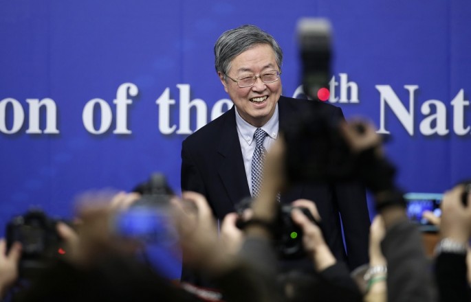 China's central bank governor Zhou Xiaochuan arrives at a news conference during the annual session of the National People's Congress (NPC), the country's parliament, in Beijing, March 12, 2015. 