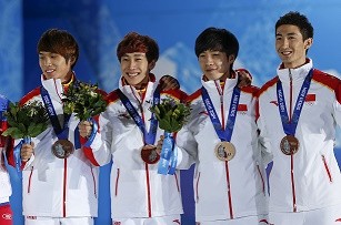China's bronze medalists Chen Degua, Han Tianyu, Shi Jingnan and Wu Dajing during the victory ceremony for the men's 5,000-meter relay short track speed skating at the 2014 Sochi Winter Olympics.