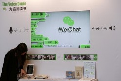 A counter promoting WeChat, a product of Tencent, is displayed at a news conference in Hong Kong.