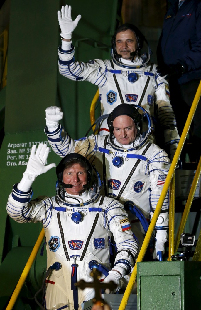 U.S. astronaut Scott Kelly (C), Russian cosmonauts Gennady Padalka, and Mikhail Korniyenko (top)