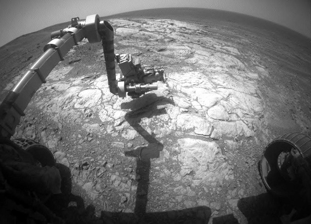 NASA's Mars Exploration Rover Opportunity has extended its robotic arm for studying a light-toned rock target called "Athens" in this image from the rover's front hazard avoidance camera.