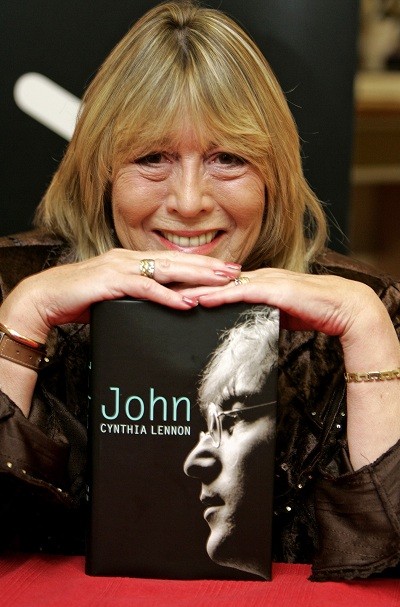 Cynthia Lennon, first wife of former Beatle John Lennon, poses with copies of her newly published biography entitled "John" at a central London bookshop September 26, 2005.