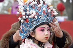 A young performer readies herself during a performance at the Lunar New Year in Taiyuan, Shanxi Province.