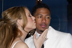 Musician Mariah Carey and husband Nick Cannon attend a photo call near the Eiffel Tower before their vow renewal ceremony in Paris April 27, 2012