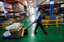 An employee works at an Alibaba warehouse on the outskirts of Hangzhou, Zhejiang Province. China’s cabinet recently rolled out several policies to benefit the nation’s e-commerce sector.